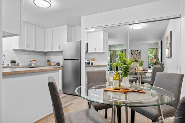 13932 NE 60th St Unit 150, Redmond, WA 98052 - dining space featuring light wood finished floors