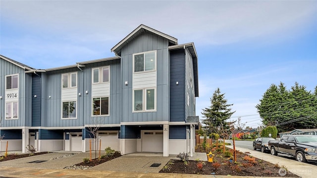 16111 36th Ave W Unit A2, Lynnwood, WA 98087 - view of front of house with a garage, board and batten siding, and driveway