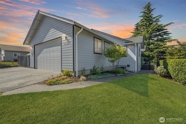 2460 Pine Dr, Ferndale, WA 98248 - view of property exterior with a lawn, a garage, and concrete driveway