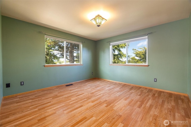 2460 Pine Dr, Ferndale, WA 98248 - unfurnished room with wood finished floors and baseboards