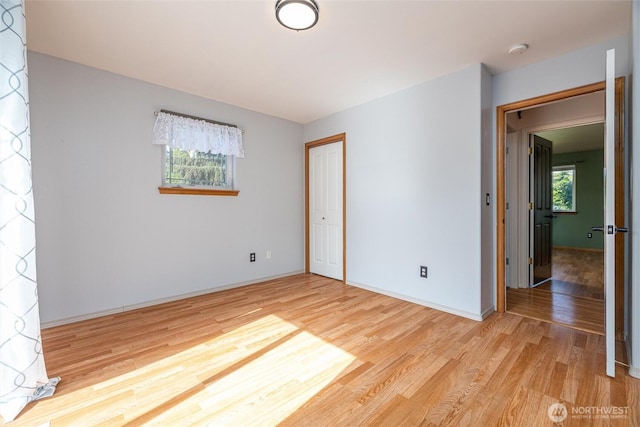 2460 Pine Dr, Ferndale, WA 98248 - unfurnished bedroom with wood finished floors and a closet