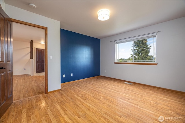 2460 Pine Dr, Ferndale, WA 98248 - empty room featuring light wood-style flooring and a smoke detector