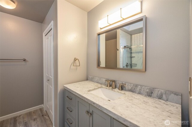 2460 Pine Dr, Ferndale, WA 98248 - bathroom with vanity, wood finished floors, and a shower