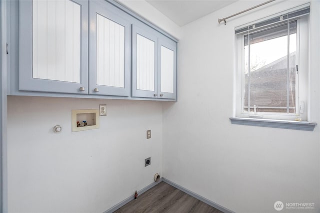2460 Pine Dr, Ferndale, WA 98248 - laundry room with hookup for a gas dryer, hookup for an electric dryer, cabinet space, and wood finished floors