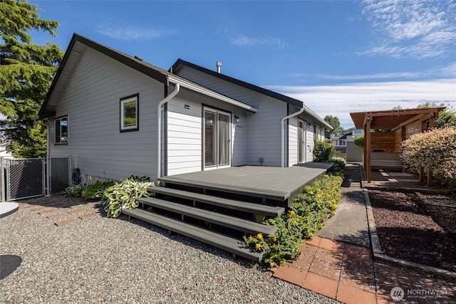 2460 Pine Dr, Ferndale, WA 98248 - rear view of house featuring a wooden deck and a gate