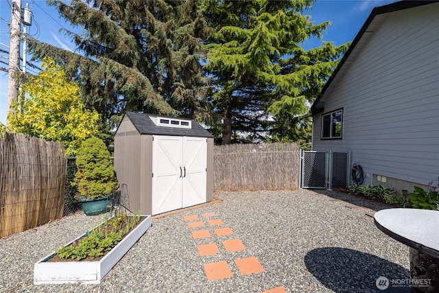 2460 Pine Dr, Ferndale, WA 98248 - fenced backyard with a storage unit and a gate