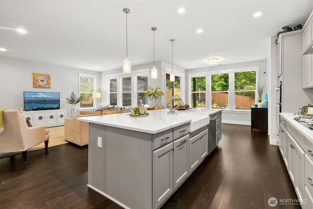 305 Field Pl SE, Renton, WA 98059 - kitchen featuring gray cabinets, healthy amount of natural light, dark wood finished floors, and recessed lighting