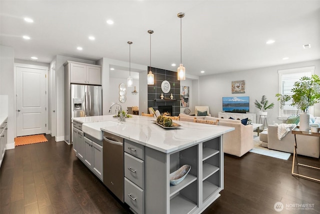 305 Field Pl SE, Renton, WA 98059 - kitchen featuring gray cabinetry, stainless steel appliances, dark wood-style floors, open floor plan, and recessed lighting