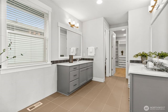 305 Field Pl SE, Renton, WA 98059 - bathroom featuring vanity, plenty of natural light, a spacious closet, and recessed lighting