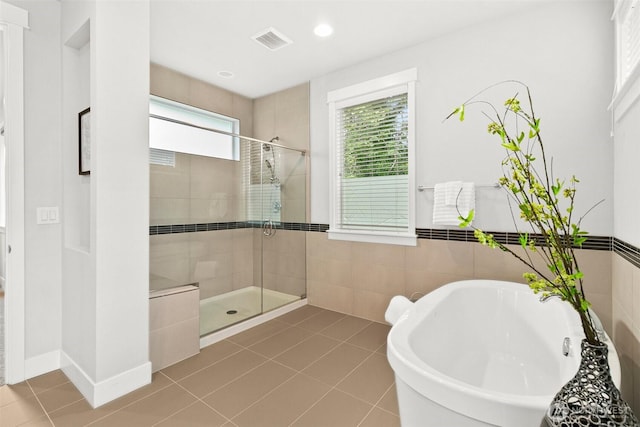 305 Field Pl SE, Renton, WA 98059 - bathroom featuring a soaking tub, a shower stall, tile patterned flooring, and recessed lighting