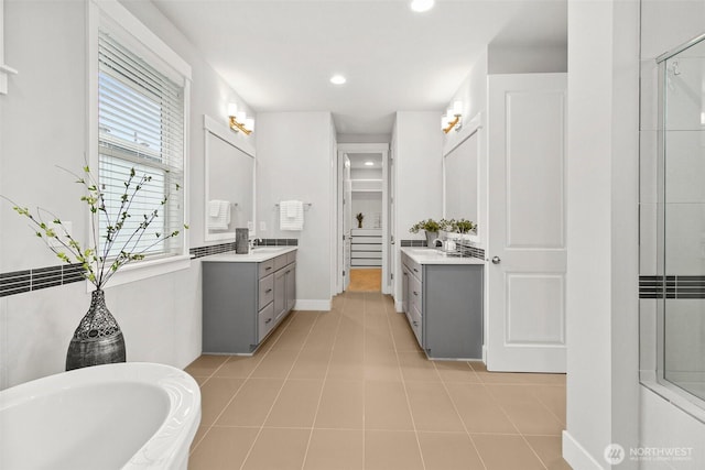 305 Field Pl SE, Renton, WA 98059 - full bathroom featuring two vanities, a tub to relax in, a shower, recessed lighting, and a closet