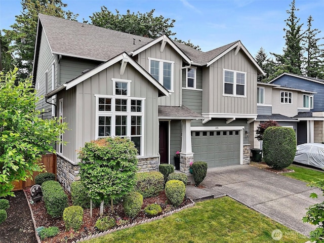 305 Field Pl SE, Renton, WA 98059 - craftsman inspired home featuring stone siding, a shingled roof, concrete driveway, a garage, and board and batten siding