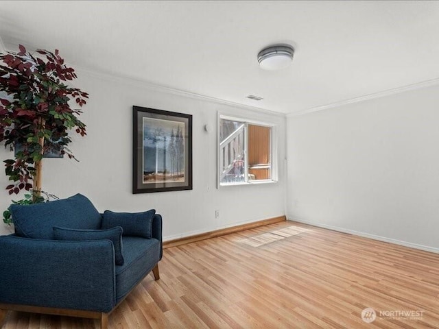 3601 S Spokane St Unit 1-1, Seattle, WA 98144 - living area with crown molding and light wood-type flooring