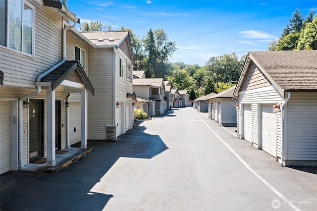 14335 Simonds Rd NE Unit A305, Kirkland, WA 98034 - view of street featuring community garages and a residential view
