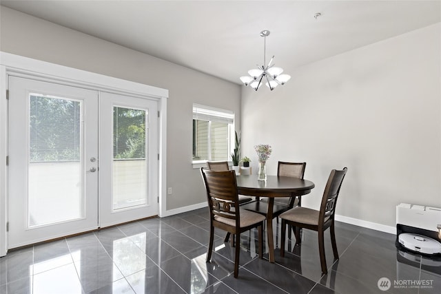 14335 Simonds Rd NE Unit A305, Kirkland, WA 98034 - dining room with a chandelier, french doors, and dark tile patterned floors