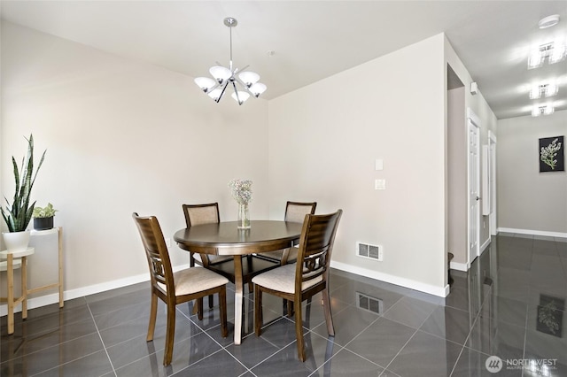 14335 Simonds Rd NE Unit A305, Kirkland, WA 98034 - dining area with a chandelier and dark tile patterned flooring