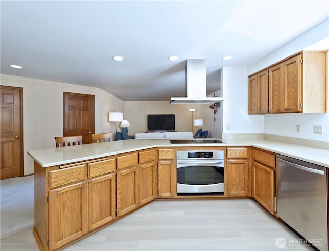 22019 NE 26th Pl, Sammamish, WA 98074 - kitchen with stainless steel appliances, wall chimney exhaust hood, a peninsula, light countertops, and recessed lighting
