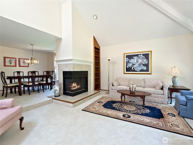 22019 NE 26th Pl, Sammamish, WA 98074 - living area with carpet floors, high vaulted ceiling, a chandelier, a tiled fireplace, and built in shelves