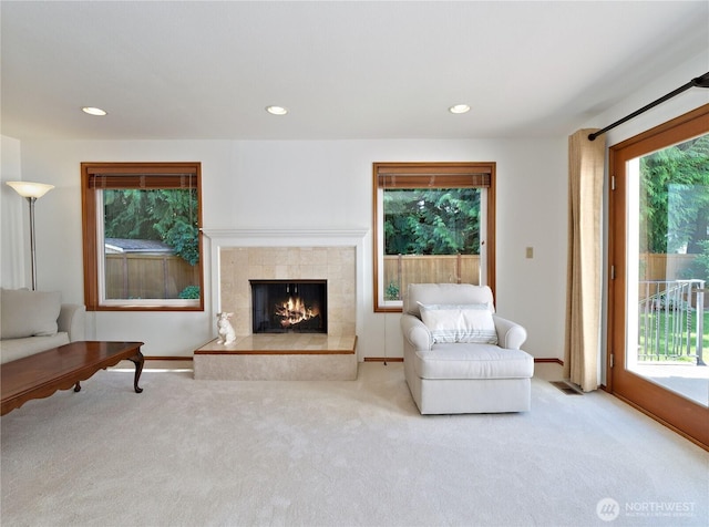22019 NE 26th Pl, Sammamish, WA 98074 - carpeted living room featuring recessed lighting and a tile fireplace