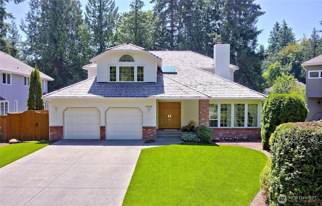 22019 NE 26th Pl, Sammamish, WA 98074 - traditional home featuring brick siding, a chimney, concrete driveway, and an attached garage