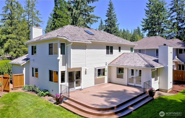 22019 NE 26th Pl, Sammamish, WA 98074 - back of house with a chimney, a deck, and french doors