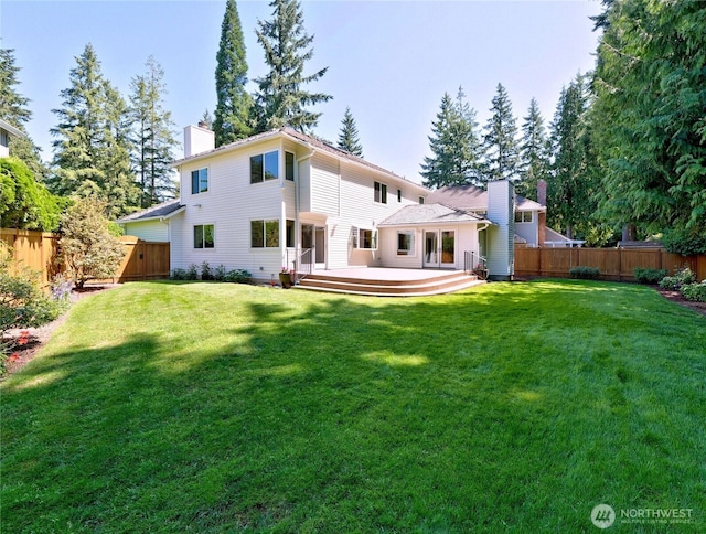 22019 NE 26th Pl, Sammamish, WA 98074 - back of house with a chimney, a fenced backyard, and a deck