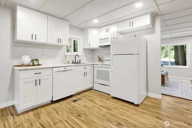 8410 Cimarron Way, Maple Falls, WA 98266 - kitchen featuring white appliances, light wood-type flooring, white cabinets, and recessed lighting