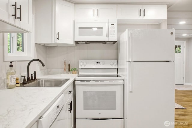 8410 Cimarron Way, Maple Falls, WA 98266 - kitchen with white appliances, white cabinets, wood finished floors, and light stone countertops