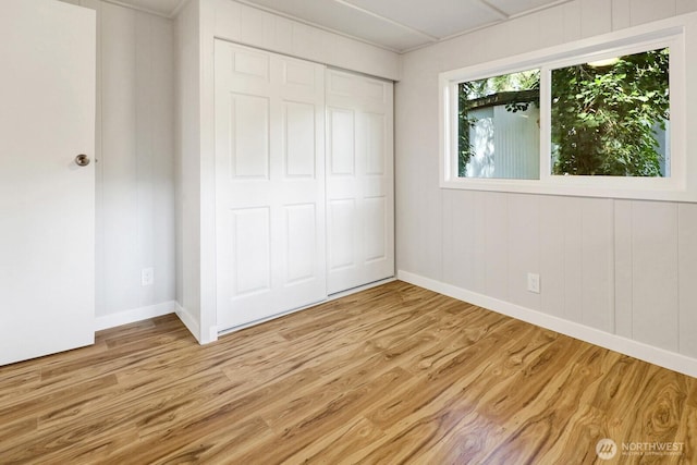 8410 Cimarron Way, Maple Falls, WA 98266 - unfurnished bedroom featuring light wood-style flooring and a closet