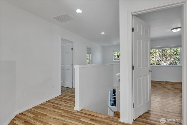 7003 Radius Loop SE, Lacey, WA 98513 - hallway with an upstairs landing, wood finished floors, and recessed lighting