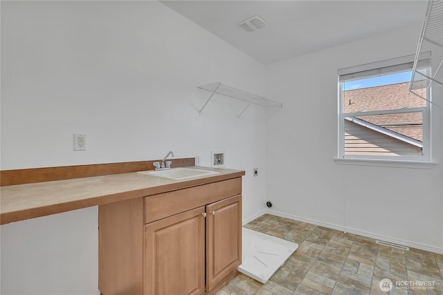 7003 Radius Loop SE, Lacey, WA 98513 - laundry room with hookup for an electric dryer, washer hookup, cabinet space, and stone finish floors