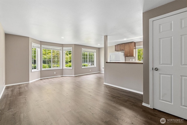 507 Madison Ave, Everett, WA 98203 - unfurnished living room featuring dark wood-type flooring and recessed lighting