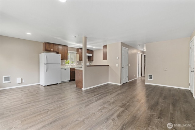 507 Madison Ave, Everett, WA 98203 - unfurnished living room with dark wood-style floors and recessed lighting