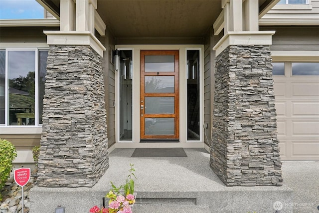 5624 S 344th Ct, Auburn, WA 98001 - doorway to property with stone siding and a garage