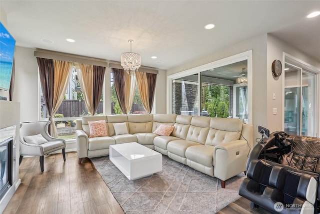 5624 S 344th Ct, Auburn, WA 98001 - living room with healthy amount of natural light, recessed lighting, hardwood / wood-style floors, and a chandelier