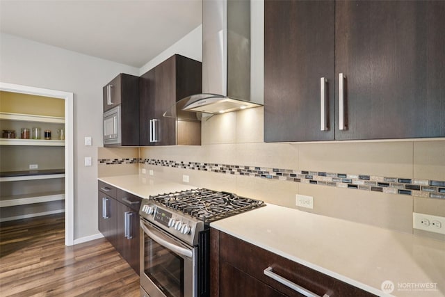 5624 S 344th Ct, Auburn, WA 98001 - kitchen with stainless steel appliances, wall chimney range hood, light countertops, dark wood finished floors, and dark brown cabinetry