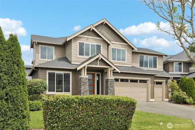 5624 S 344th Ct, Auburn, WA 98001 - view of front of home featuring an attached garage, driveway, and roof with shingles