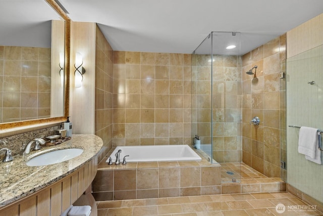 3600 Suncadia Trl Unit 1137, Cle Elum, WA 98922 - full bath featuring vanity, a bath, tiled shower, tile walls, and tile patterned floors