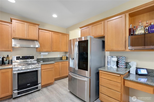 13034 SE 209th Ct, Kent, WA 98031 - kitchen featuring appliances with stainless steel finishes, ventilation hood, light wood finished floors, stone counters, and recessed lighting