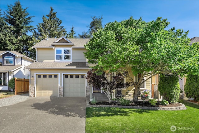13034 SE 209th Ct, Kent, WA 98031 - view of front of home featuring driveway, an attached garage, roof with shingles, and stone siding