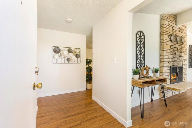 17114 SE 130th Ave, Renton, WA 98058 - hall with wood finished floors and a textured ceiling