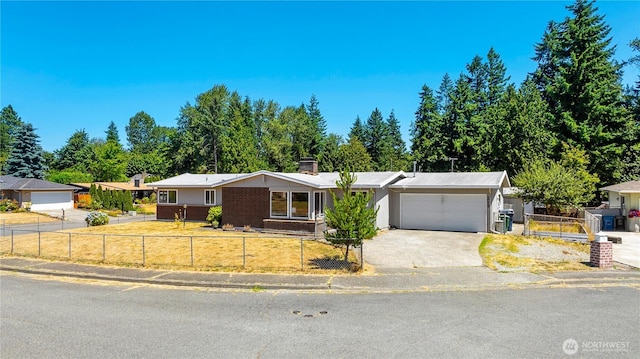 17114 SE 130th Ave, Renton, WA 98058 - ranch-style house featuring a fenced front yard, a garage, a chimney, concrete driveway, and brick siding