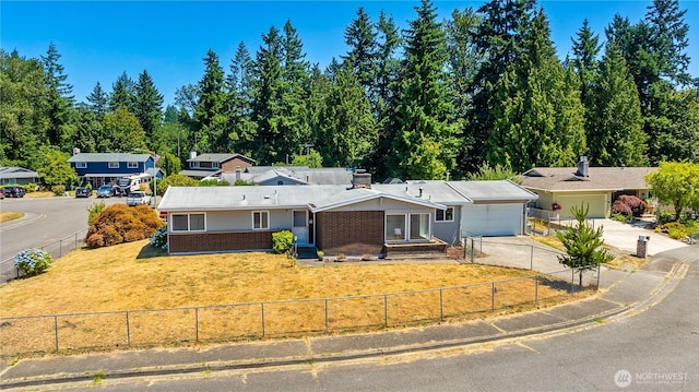 17114 SE 130th Ave, Renton, WA 98058 - ranch-style home with concrete driveway, an attached garage, brick siding, and a chimney