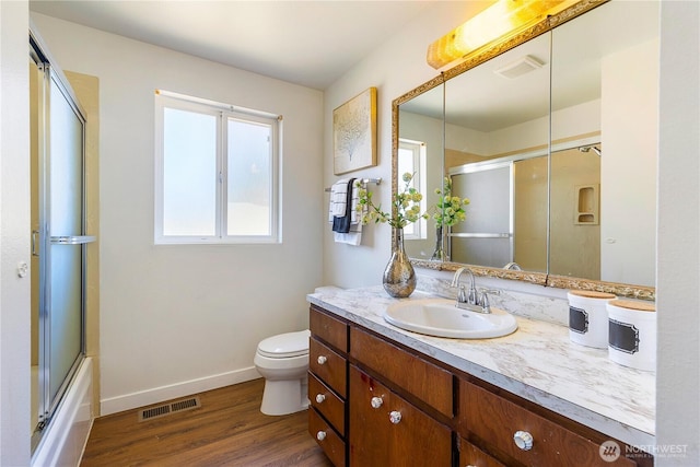 17114 SE 130th Ave, Renton, WA 98058 - bathroom featuring wood finished floors, vanity, and combined bath / shower with glass door