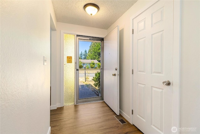 17114 SE 130th Ave, Renton, WA 98058 - entrance foyer featuring wood finished floors and a textured ceiling