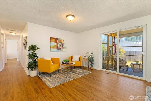 17114 SE 130th Ave, Renton, WA 98058 - living area with wood finished floors and a textured ceiling