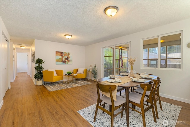 17114 SE 130th Ave, Renton, WA 98058 - dining space featuring a textured ceiling and light wood-type flooring