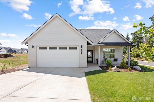 251 Sweet Gum Dr, Blaine, WA 98230 - view of front of property featuring driveway, roof with shingles, a garage, a front yard, and a porch