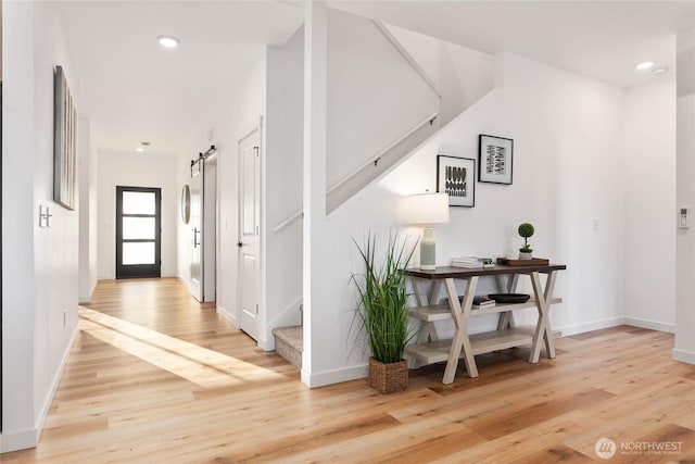 251 Sweet Gum Dr, Blaine, WA 98230 - hall with stairway, light wood-style flooring, recessed lighting, and a barn door
