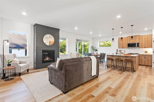 251 Sweet Gum Dr, Blaine, WA 98230 - living room with light wood-style floors, a large fireplace, and recessed lighting